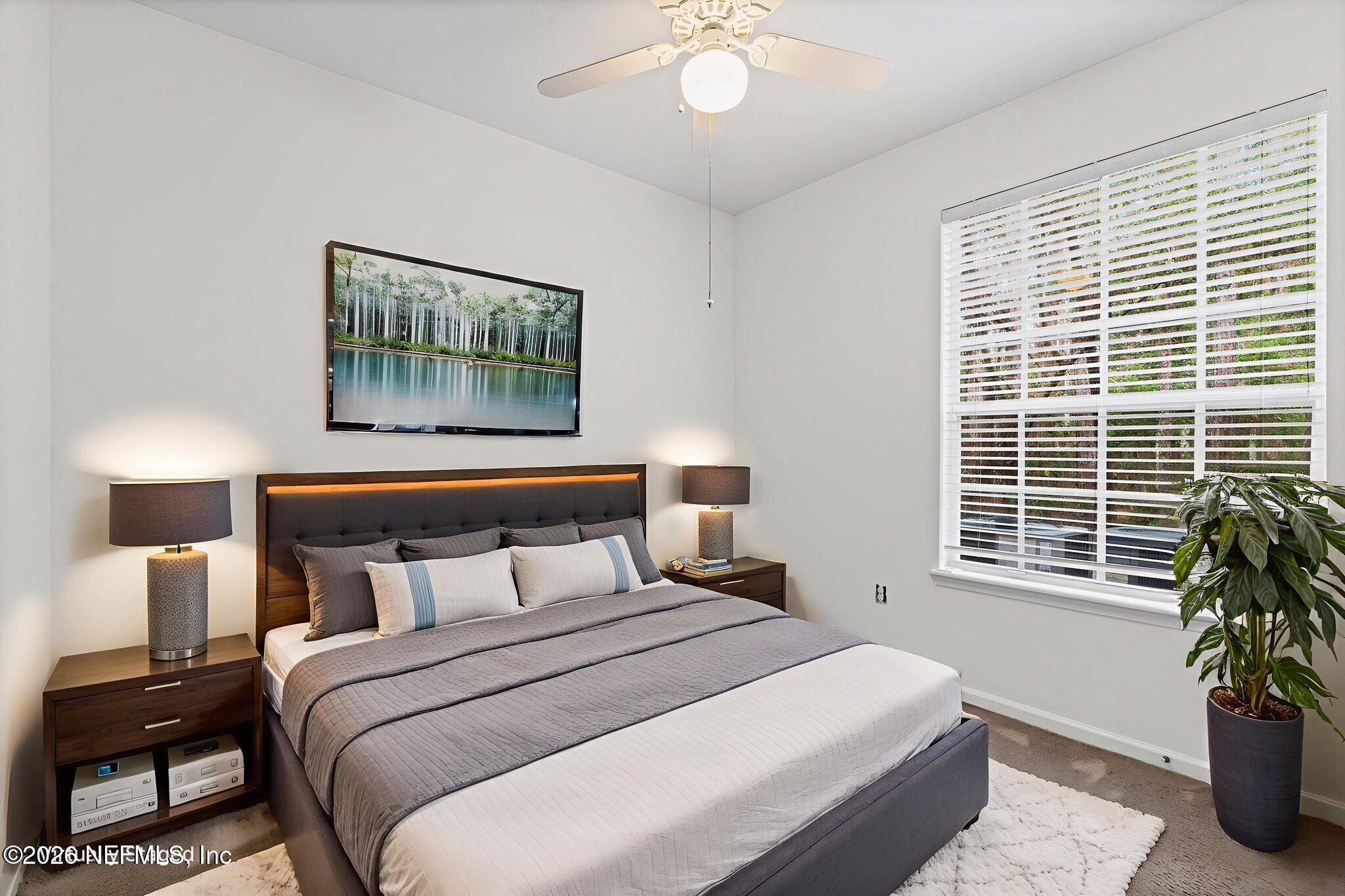 10550 Baymeadows Road, Unit 601 Jacksonville, FL 32256 - Photo 13 of 37 a bedroom with a bed and a window