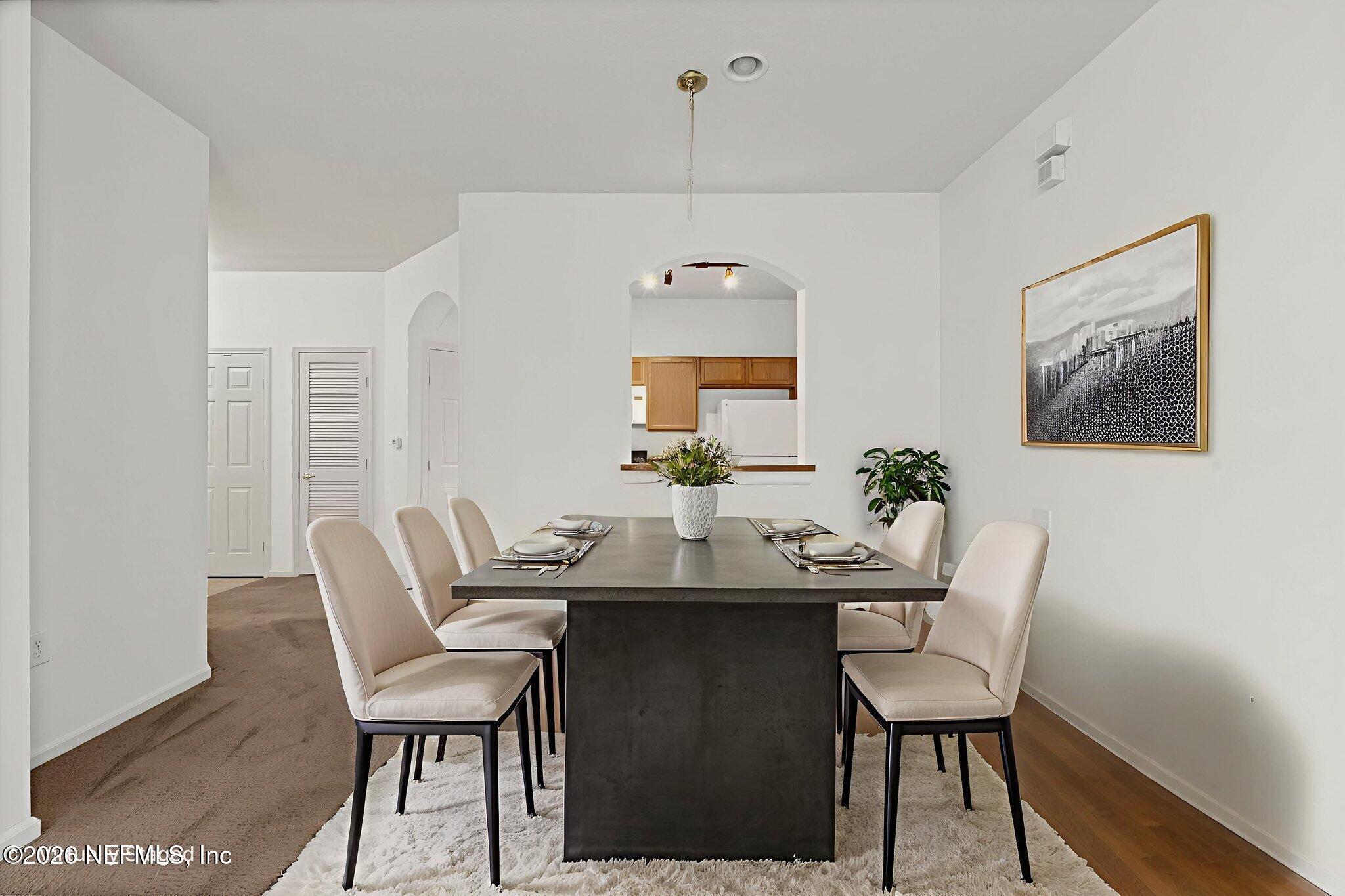10550 Baymeadows Road, Unit 601 Jacksonville, FL 32256 - Photo 21 of 37 a dining room with furniture and window