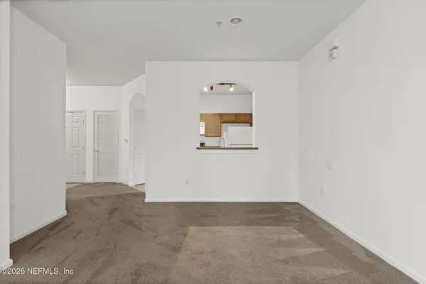 a view of a hallway with an empty room