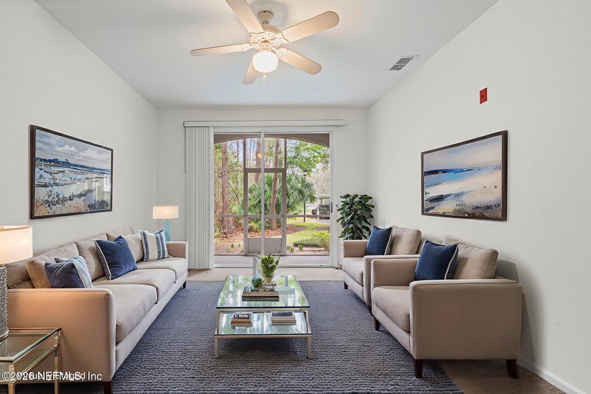 10550 Baymeadows Road, Unit 601 Jacksonville, FL 32256 - Photo 24 of 37 a living room with furniture and a large window