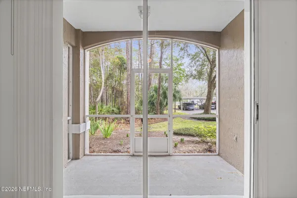 a view of a room with a large window