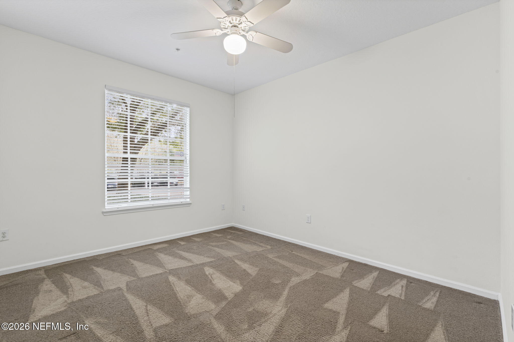 10550 Baymeadows Road, Unit 601 Jacksonville, FL 32256 - Photo 8 of 37 an empty room with a window