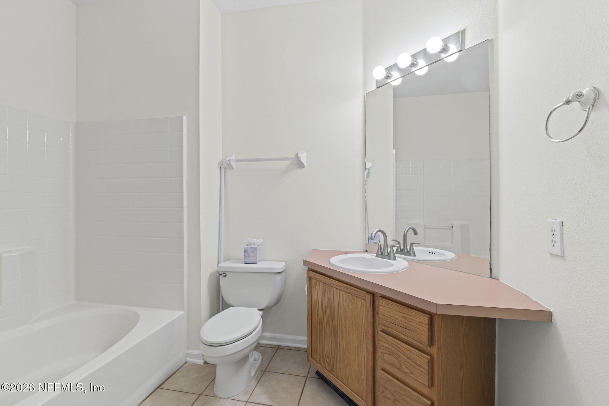 10550 Baymeadows Road, Unit 601 Jacksonville, FL 32256 - Photo 9 of 37 a bathroom with a sink a toilet and shower