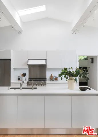 a kitchen with a sink and cabinets