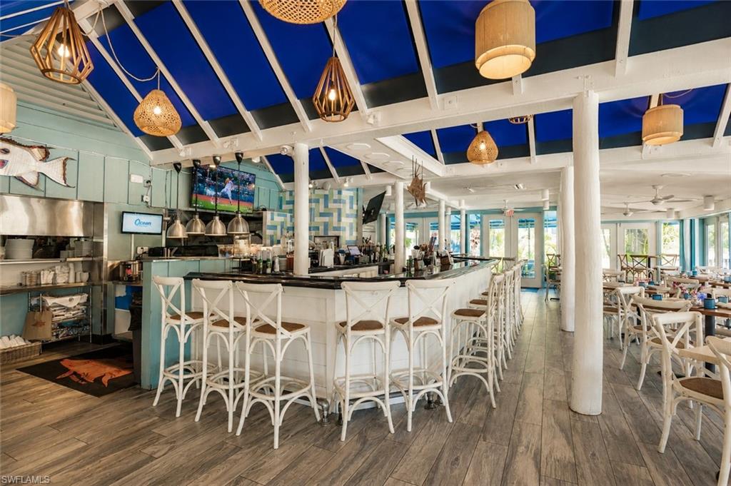 600 Neapolitan Way, Unit 449 Naples, FL 34103 - Photo 30 of 44 Hog Fish Harrys onsite Restaurant