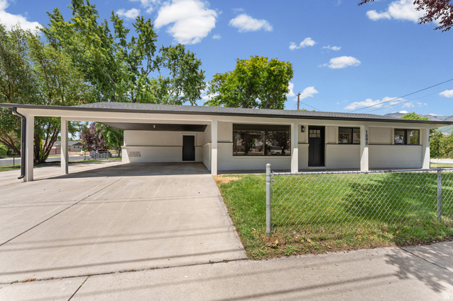 1898 West 600 South Provo, UT 84601 - Photo 3 of 32 Ranch-style exterior with a flat roofline, an attached carport, and a concrete driveway