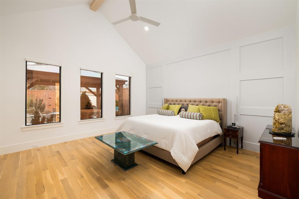 5019 Lark Lane Dallas, TX 75209 - Photo 11 of 32 a bedroom with a bed and wooden floor