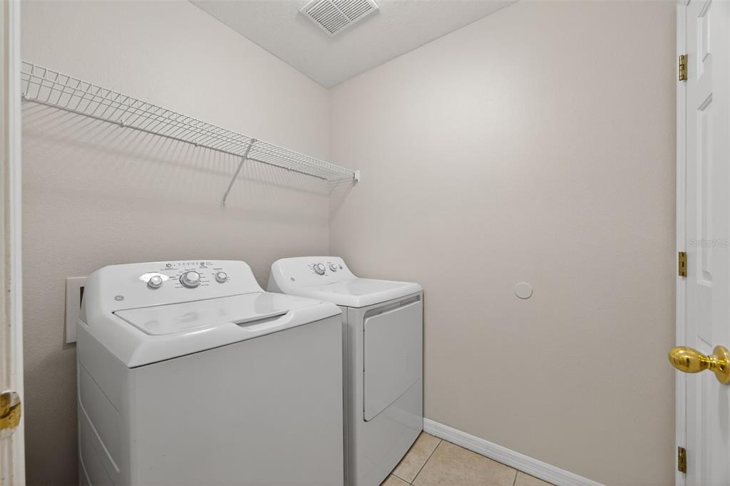6611 Gates Pointe Way Riverview, FL 33578 - Photo 12 of 55 a utility room with dryer and washer