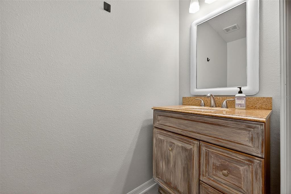 6611 Gates Pointe Way Riverview, FL 33578 - Photo 13 of 55 a bathroom with a sink vanity and mirror