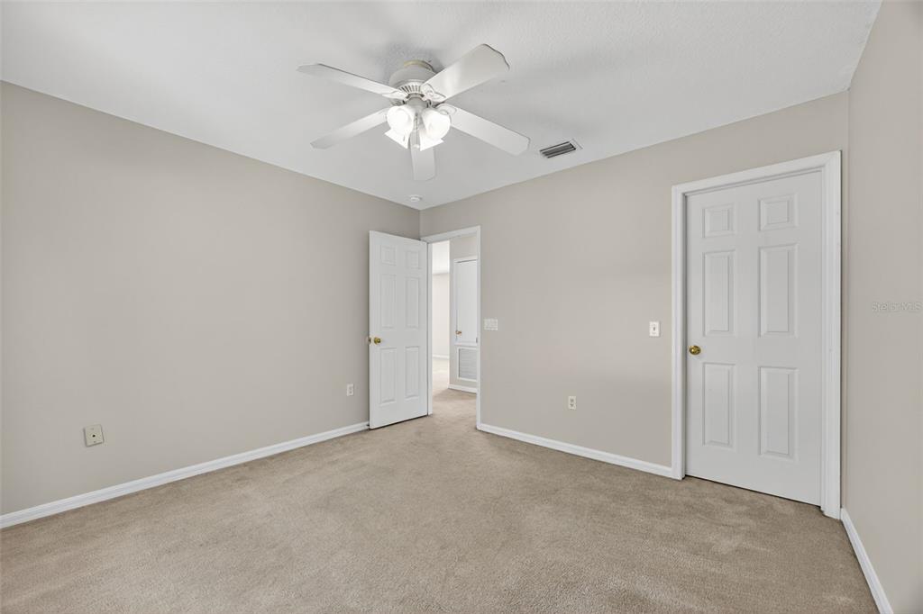 6611 Gates Pointe Way Riverview, FL 33578 - Photo 20 of 55 a view of an empty room with a chandelier fan