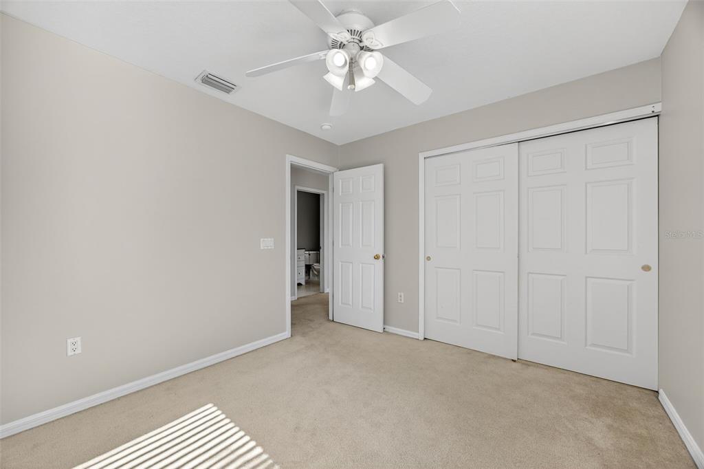6611 Gates Pointe Way Riverview, FL 33578 - Photo 22 of 55 a view of an empty room and a ceiling fan window