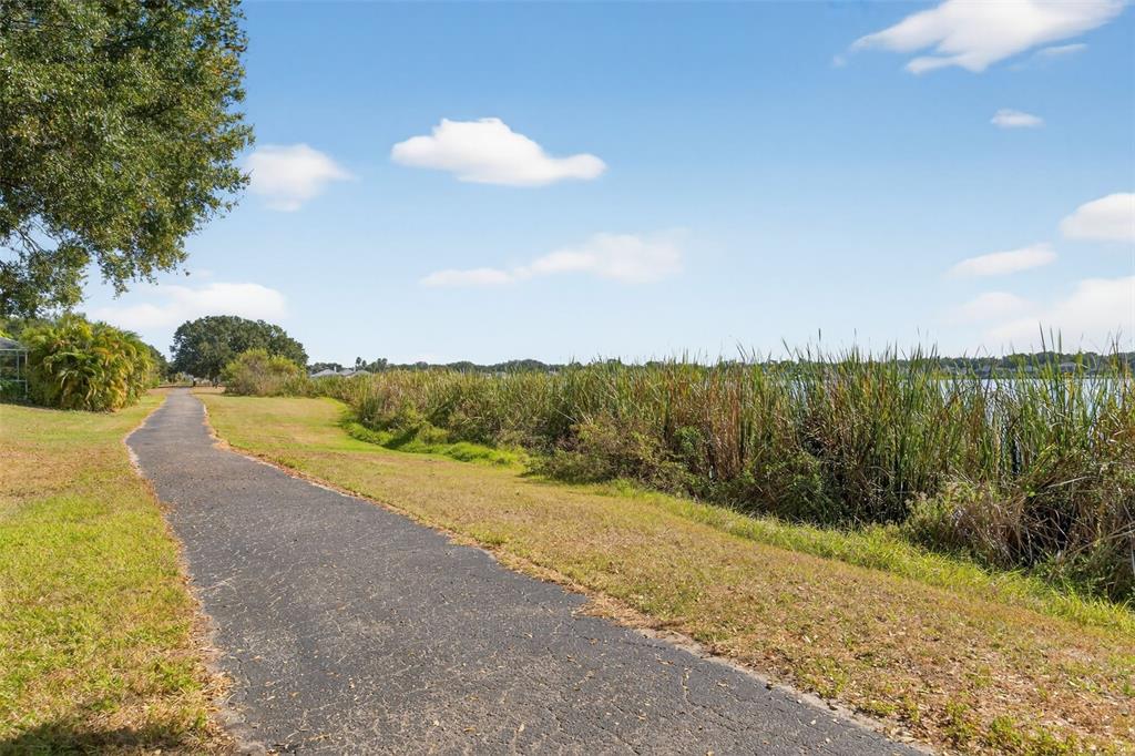 6611 Gates Pointe Way Riverview, FL 33578 - Photo 27 of 55 a view of a lake with beach in background