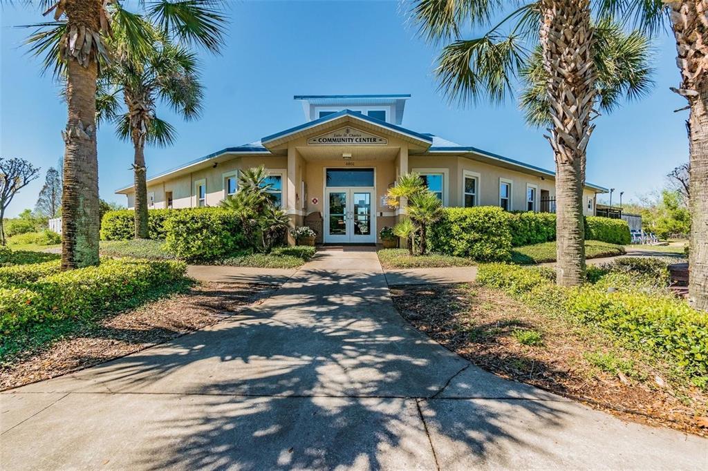 6611 Gates Pointe Way Riverview, FL 33578 - Photo 33 of 55 a front view of a house with a garden