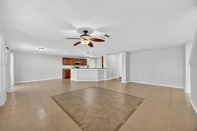 a kitchen with stainless steel appliances granite countertop a refrigerator stove and sink
