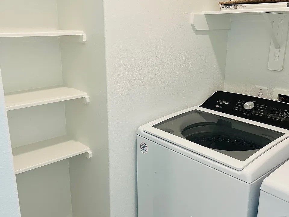 23422 Weir Box Road Hockley, TX 77447 - Photo 13 of 14 a close up view of washer and dryer