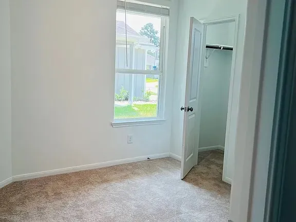 an empty room that has a window