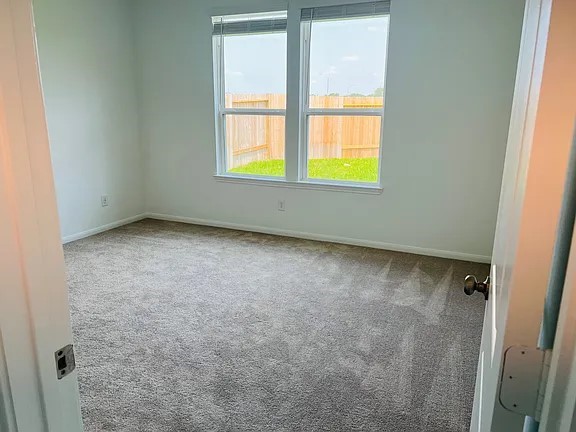 23422 Weir Box Road Hockley, TX 77447 - Photo 9 of 14 an empty room with a window