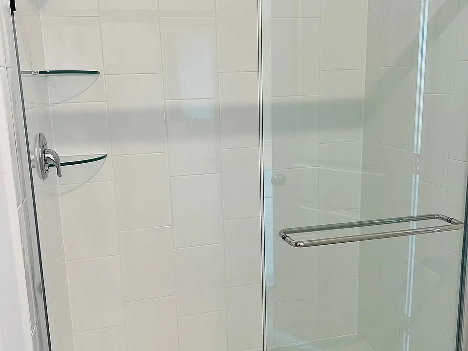 23422 Weir Box Road Hockley, TX 77447 - Photo 10 of 14 a bathroom with a glass shower door