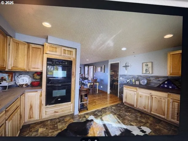 a kitchen with stainless steel appliances granite countertop a stove and a sink