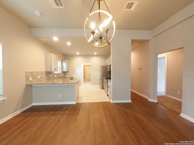 a view of a kitchen from the hallway