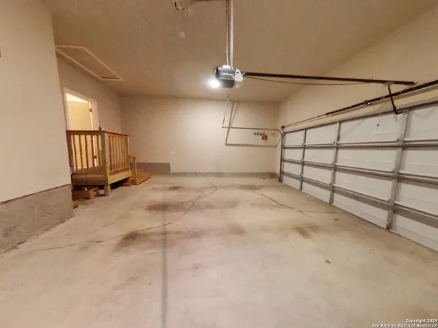 a view of a livingroom with furniture and a window