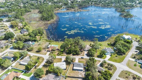 a view of a lake with a house in the background