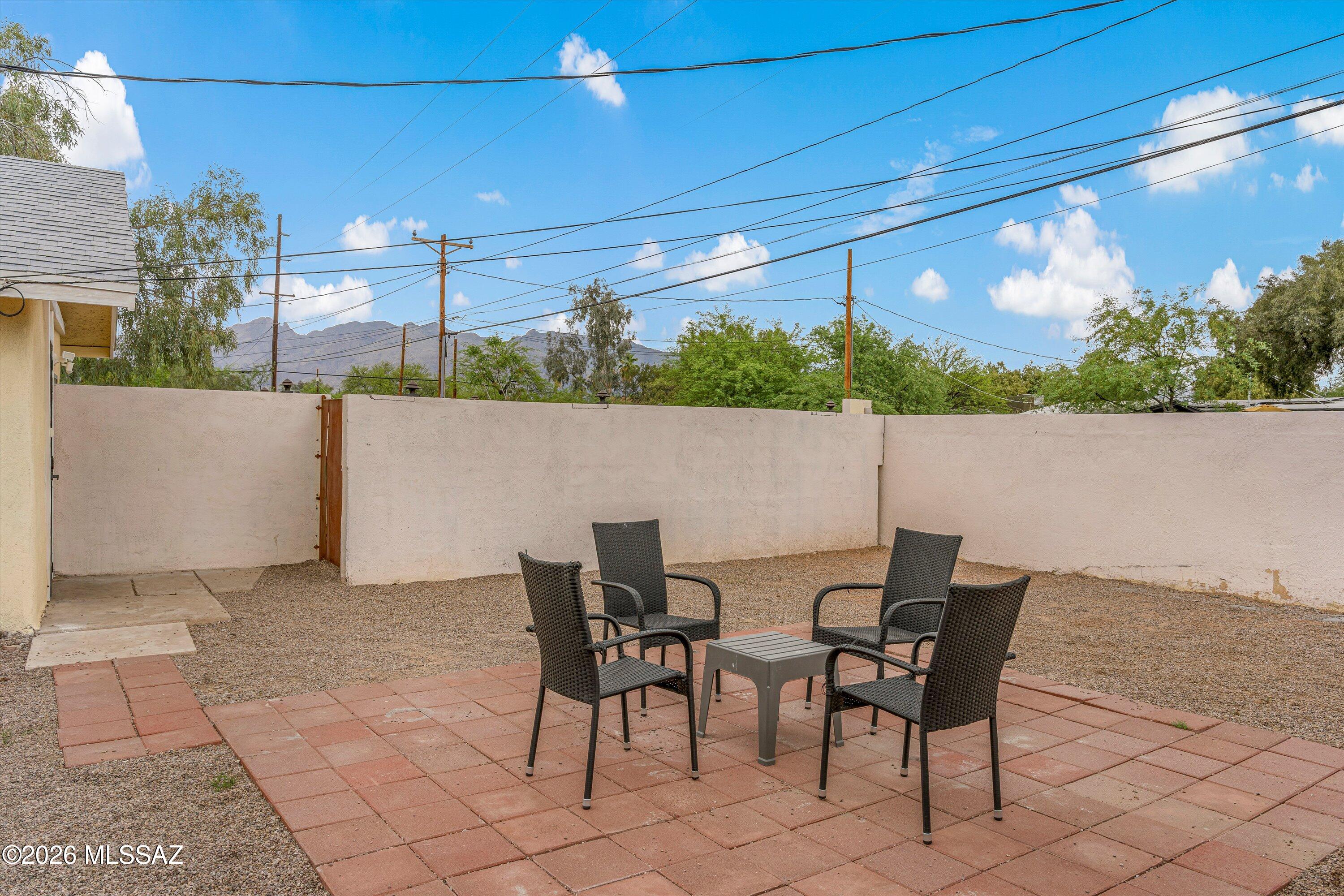 2841 North Richey Boulevard Tucson, AZ 85716 - Photo 6 of 30 a view of a terrace with furniture and a potted plant