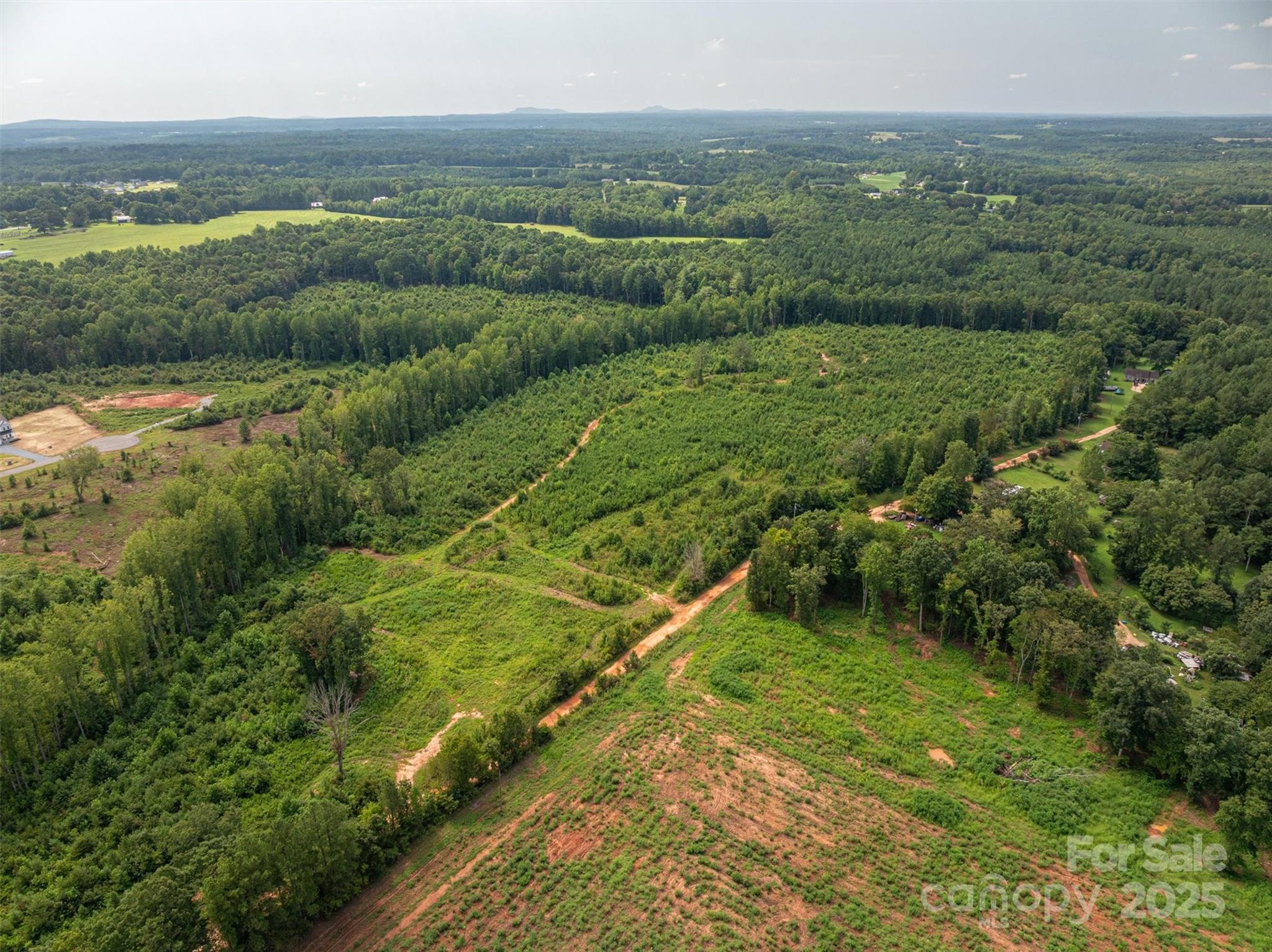 0 Westwinds Road, Unit F3 Lincolnton, NC 28092 - Photo 3 of 13 a view of a city with lush green forest
