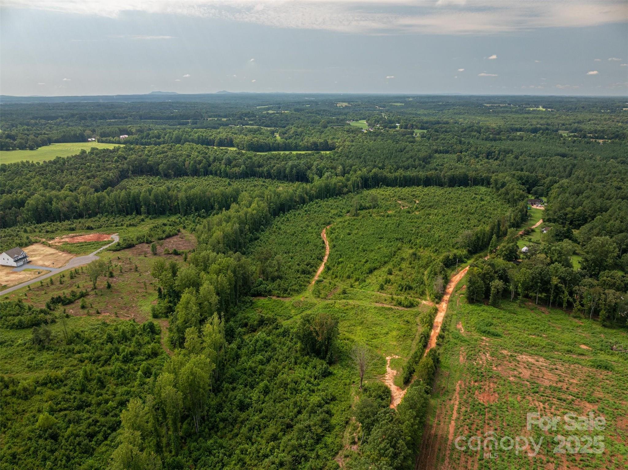 0 Westwinds Road, Unit F3 Lincolnton, NC 28092 - Photo 4 of 13 a view of a city with lush green forest