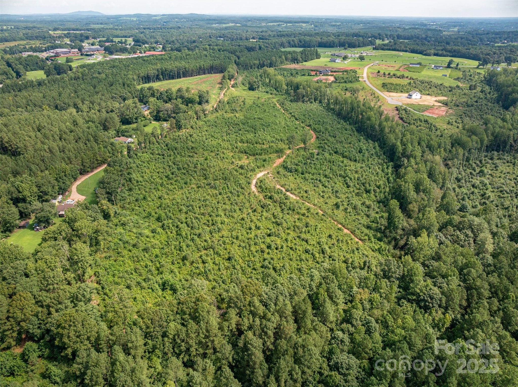 0 Westwinds Road, Unit F3 Lincolnton, NC 28092 - Photo 8 of 13 an aerial view of residential houses with outdoor space and trees