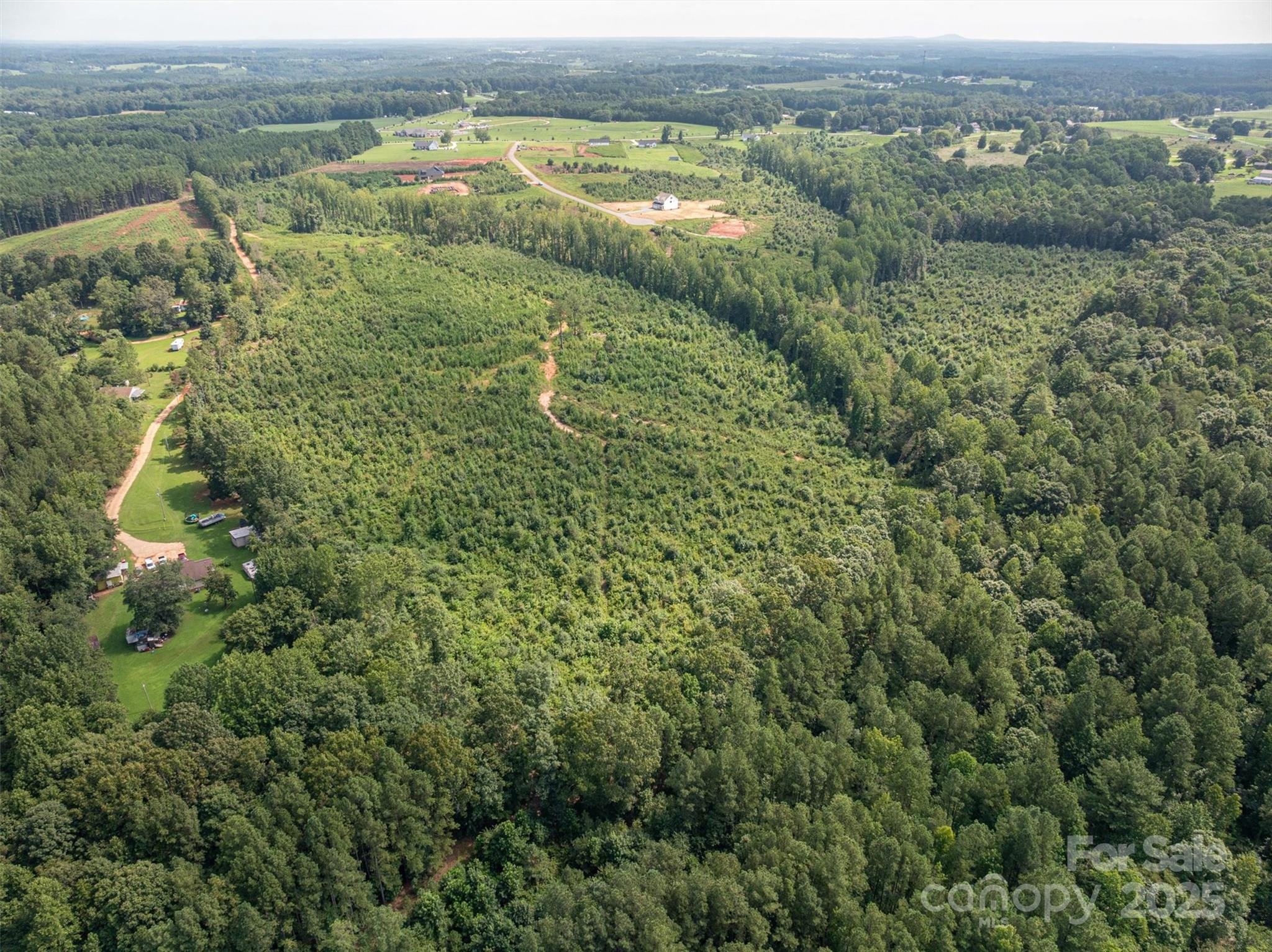 0 Westwinds Road, Unit F3 Lincolnton, NC 28092 - Photo 10 of 13 an aerial view of mountains with green space and fog