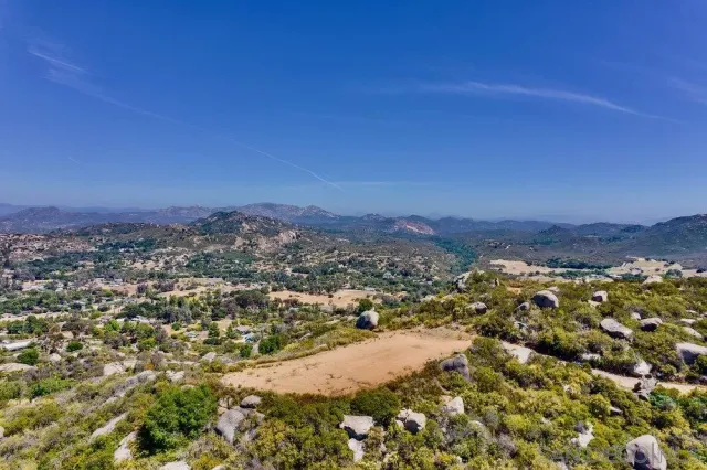 an aerial view of residential house and green space