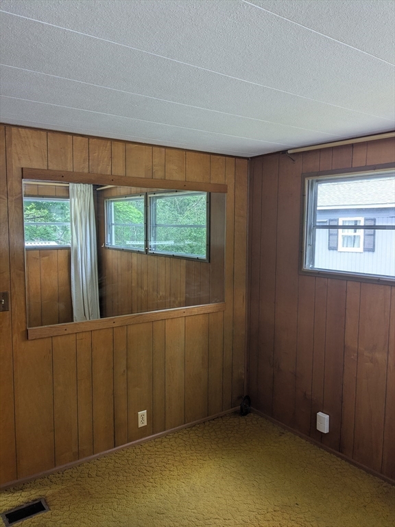 83 Clark Road, Unit 38 Shirley, MA 01464 - Photo 16 of 24 an empty room with windows