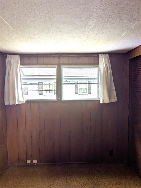 83 Clark Road, Unit 38 Shirley, MA 01464 - Photo 18 of 24 an empty room with windows