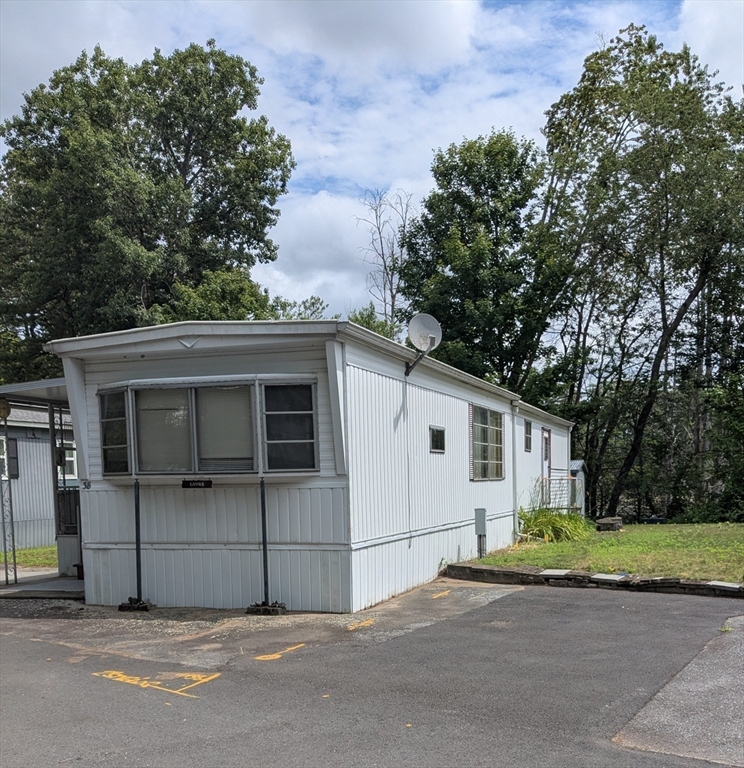 83 Clark Road, Unit 38 Shirley, MA 01464 - Photo 4 of 24 a house with a outdoor space