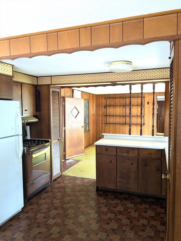 83 Clark Road, Unit 38 Shirley, MA 01464 - Photo 8 of 24 a kitchen with a refrigerator and a sink
