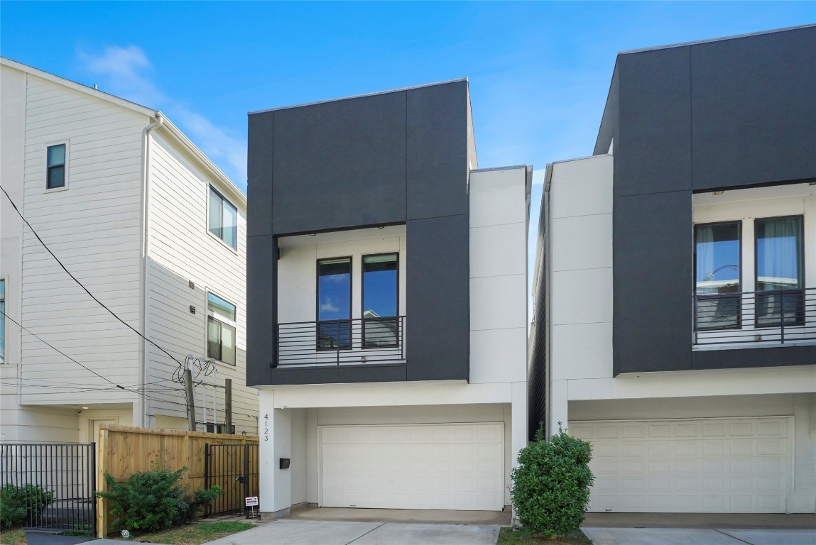 a front view of a house with a garage
