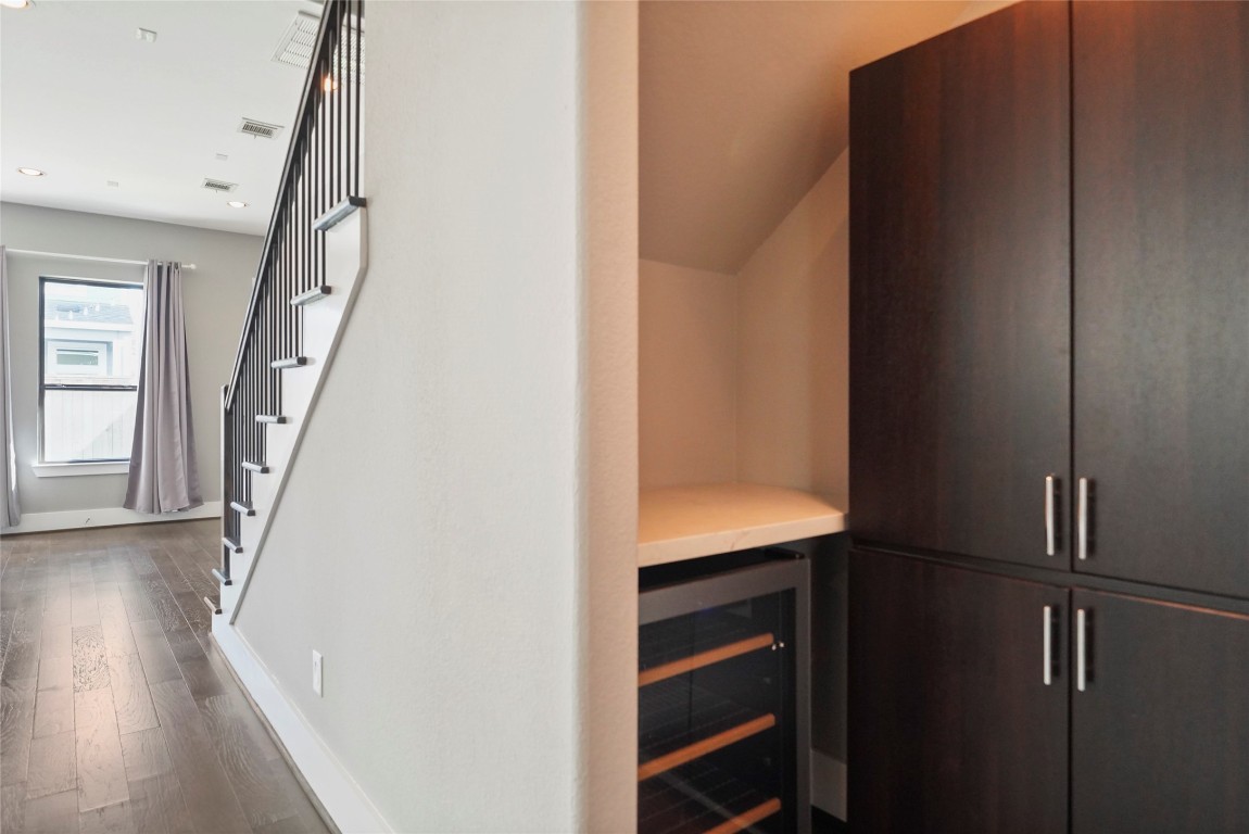 4123 Eigel Street Houston, TX 77007 - Photo 11 of 25 a view of hallway with stairs and wooden floor