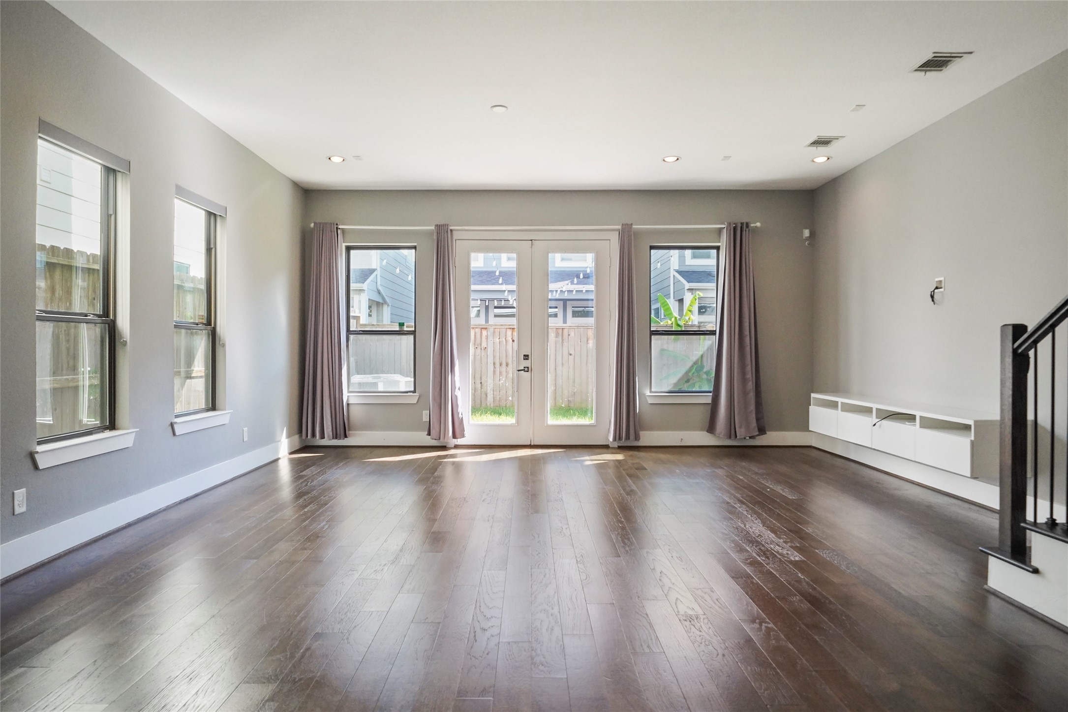 4123 Eigel Street Houston, TX 77007 - Photo 12 of 25 a view of an empty room with wooden floor and a window