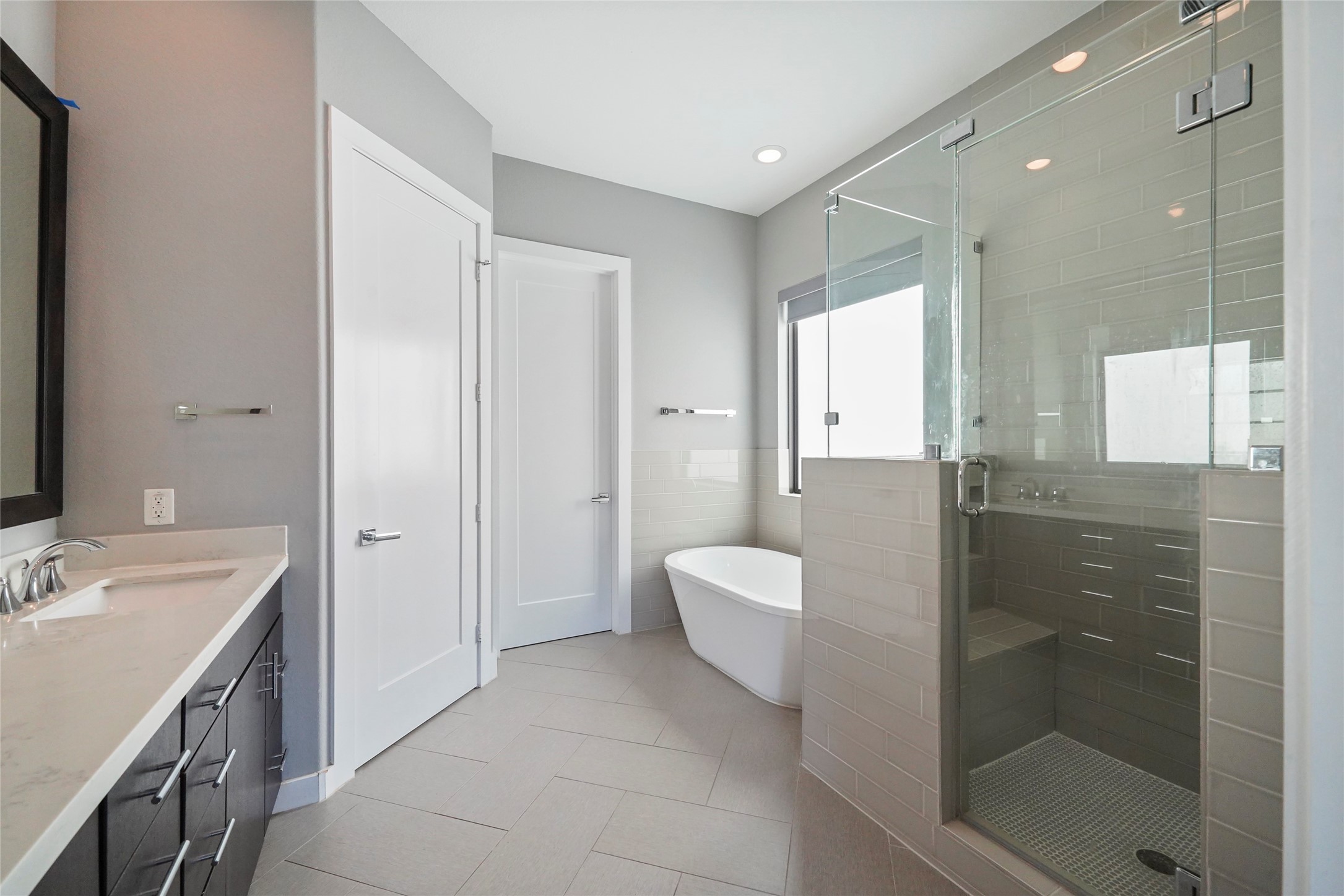 4123 Eigel Street Houston, TX 77007 - Photo 14 of 25 a bathroom with a double vanity sink toilet and shower
