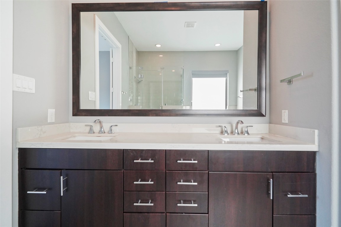 4123 Eigel Street Houston, TX 77007 - Photo 15 of 25 a bathroom with a double vanity sink and mirror