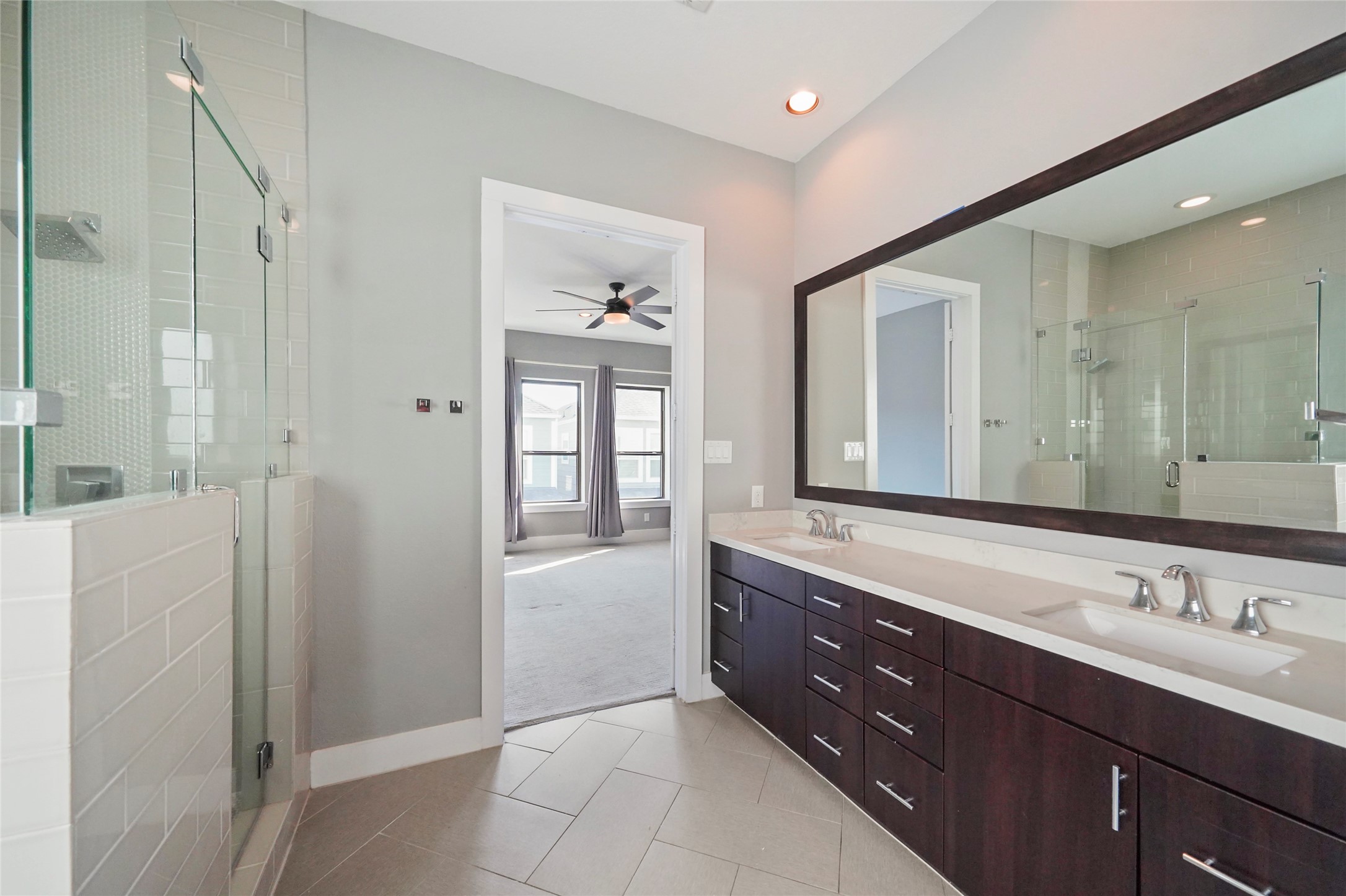 4123 Eigel Street Houston, TX 77007 - Photo 18 of 25 a spacious bathroom with a shower sink and mirror