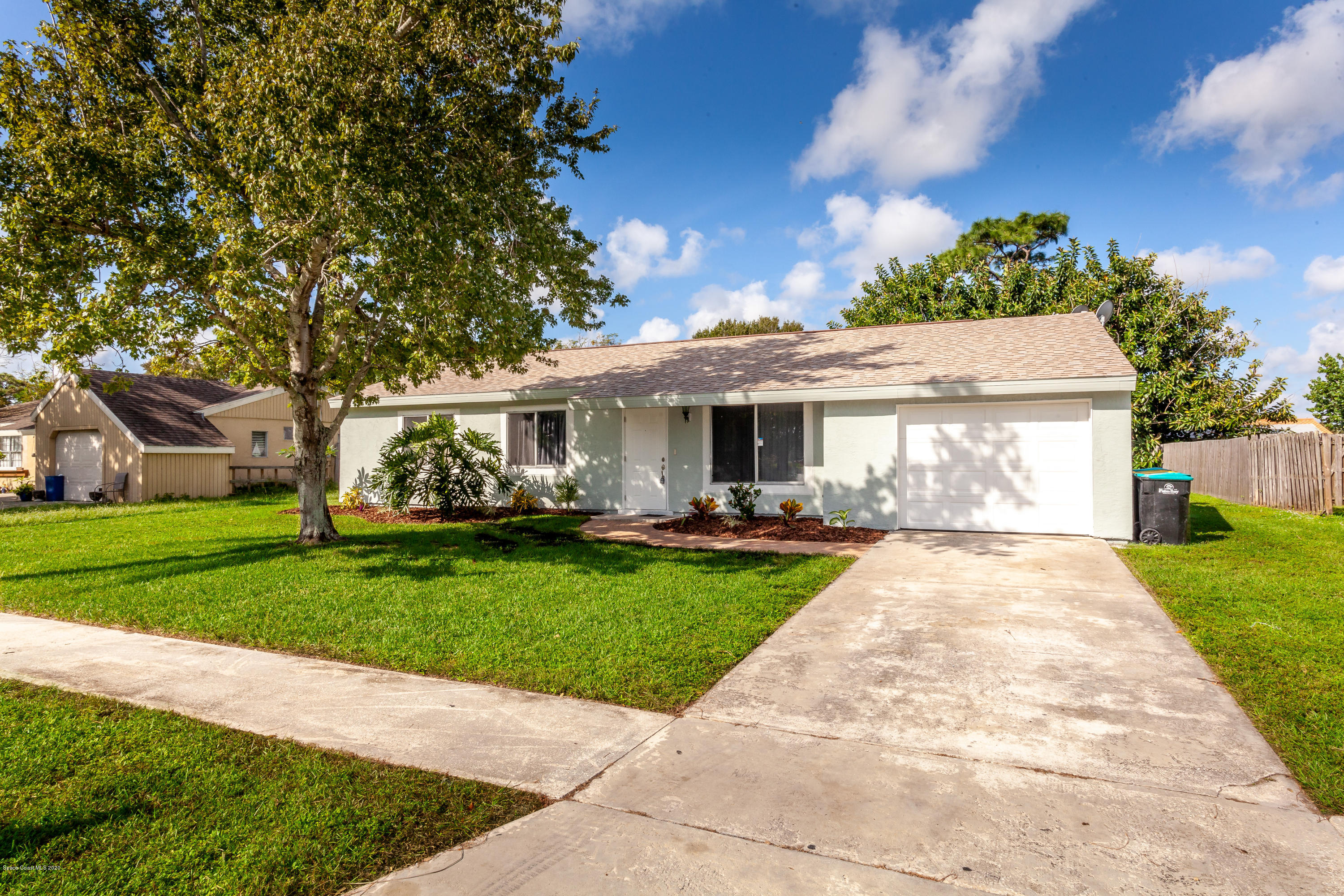 1280 Freil Road Northeast Palm Bay, FL 32905 - Photo 2 of 15 front view of a house with a yard