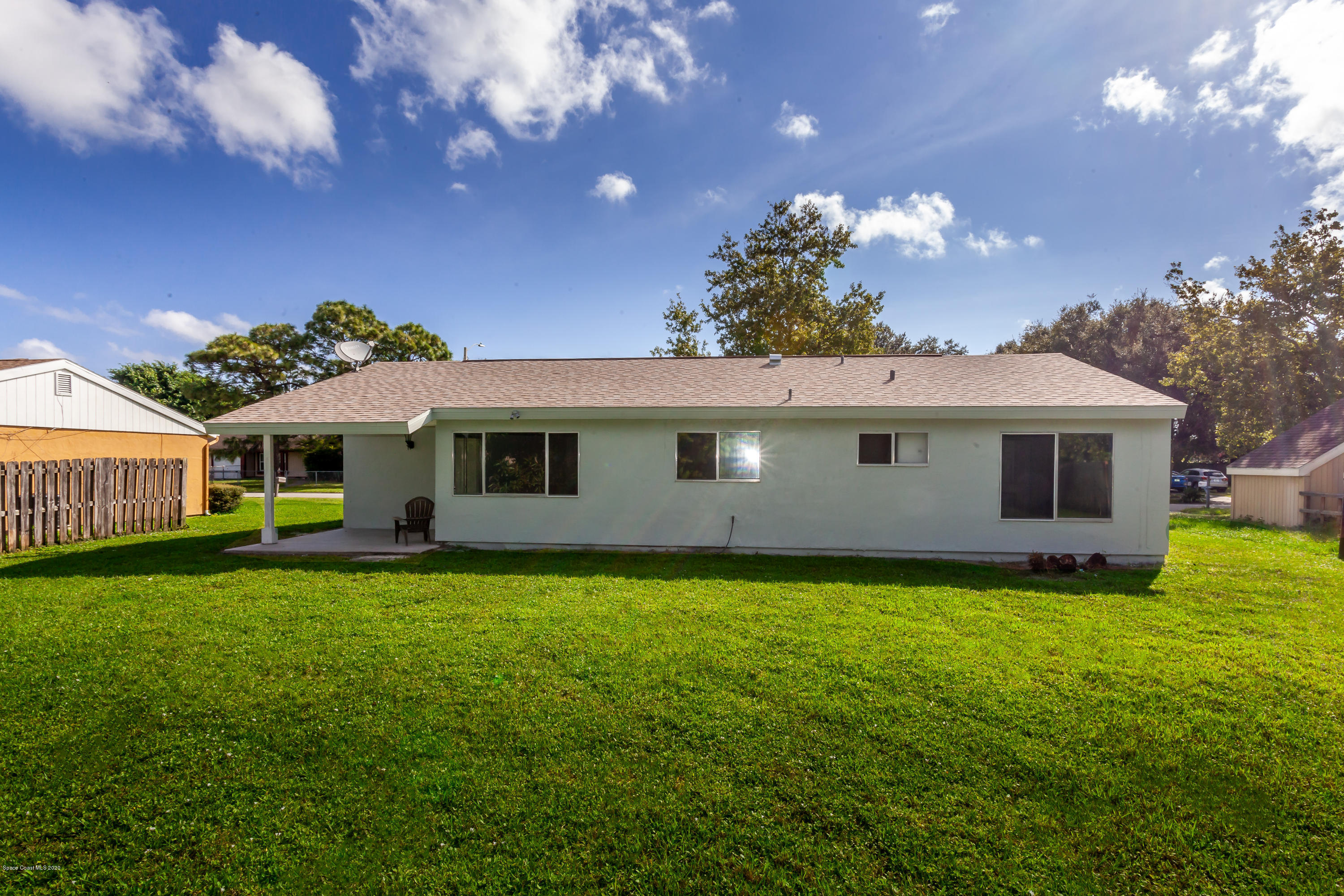 1280 Freil Road Northeast Palm Bay, FL 32905 - Photo 12 of 15 a front view of a house with garden