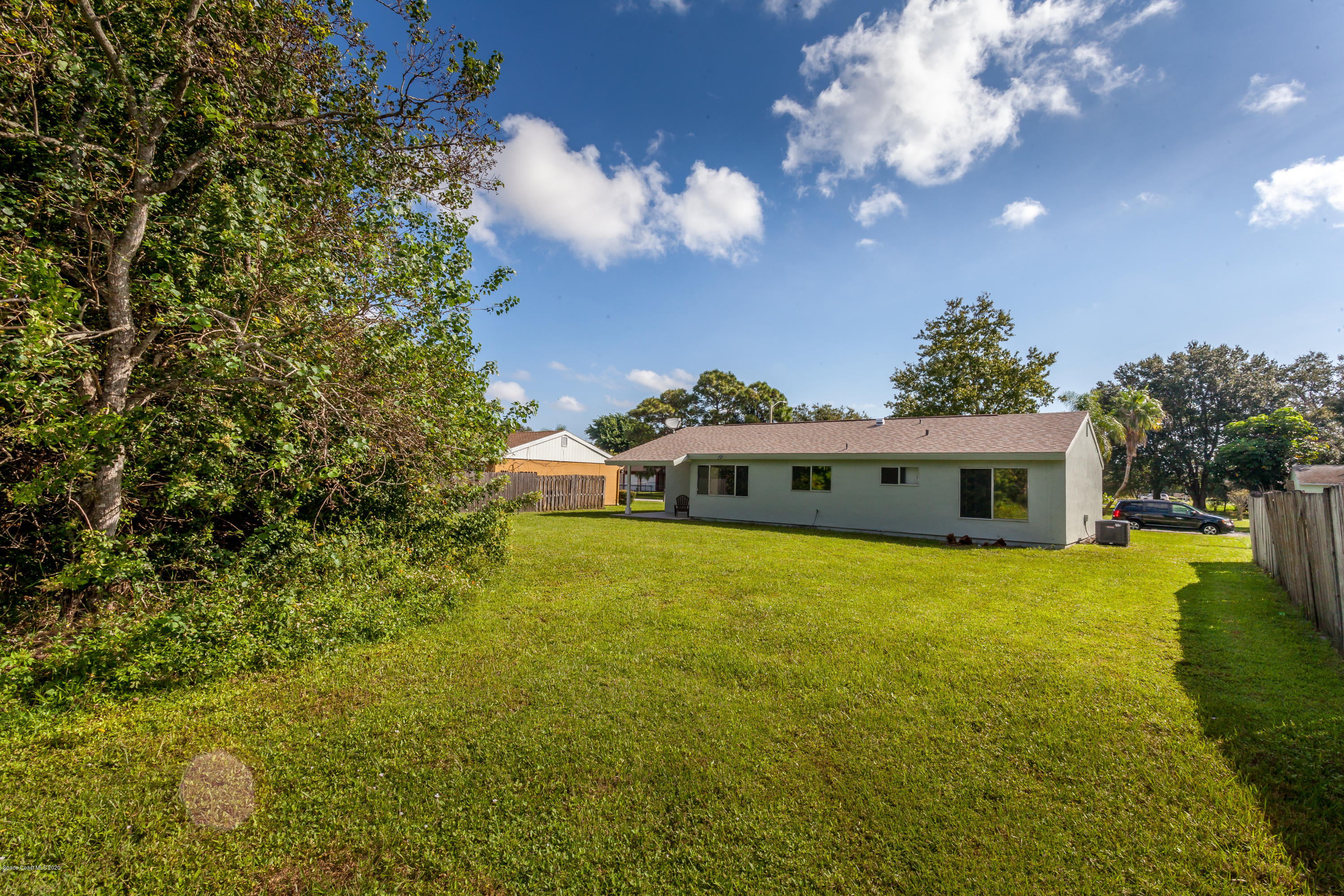 1280 Freil Road Northeast Palm Bay, FL 32905 - Photo 13 of 15 a front view of a house with a garden
