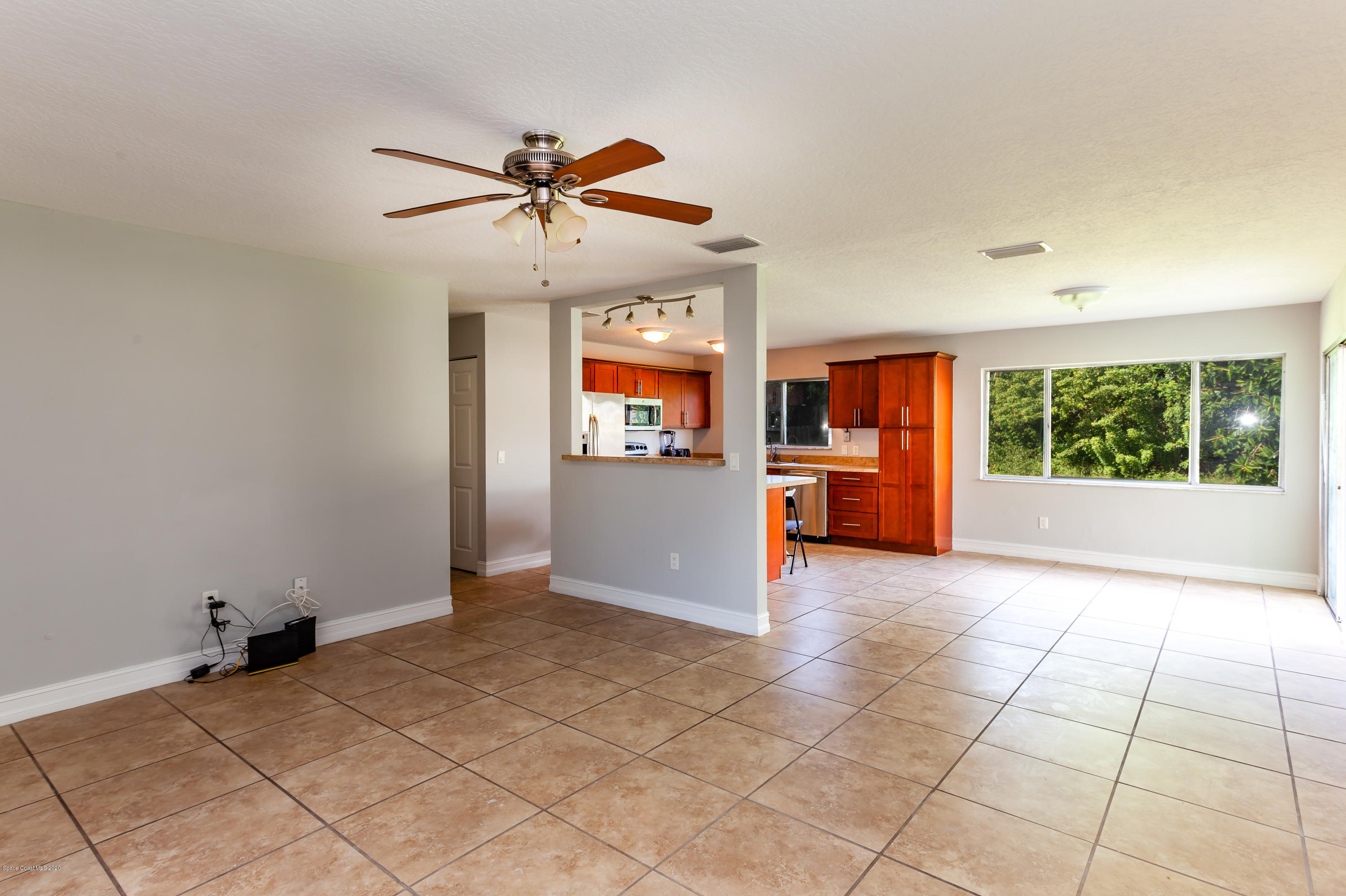 1280 Freil Road Northeast Palm Bay, FL 32905 - Photo 9 of 15 a view of an empty room with a window