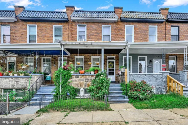 front view of a brick house with a large windows
