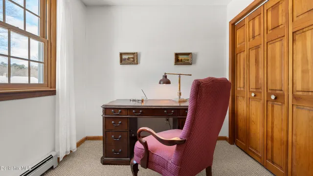 a view of a hallway with workspace
