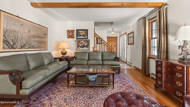 a living room with furniture and a rug