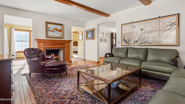 a living room with furniture or couch and a fireplace